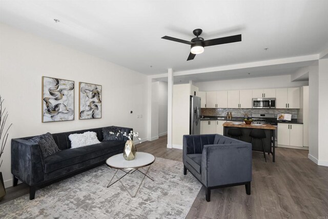 1551 4th Ave Unit 611, San Diego, CA 92101 - living area featuring baseboards, a ceiling fan, and wood finished floors