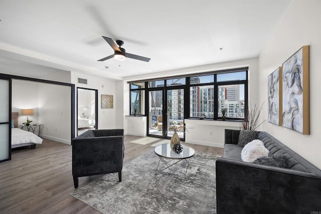 1551 4th Ave Unit 611, San Diego, CA 92101 - living room featuring baseboards, a ceiling fan, wood finished floors, and visible vents