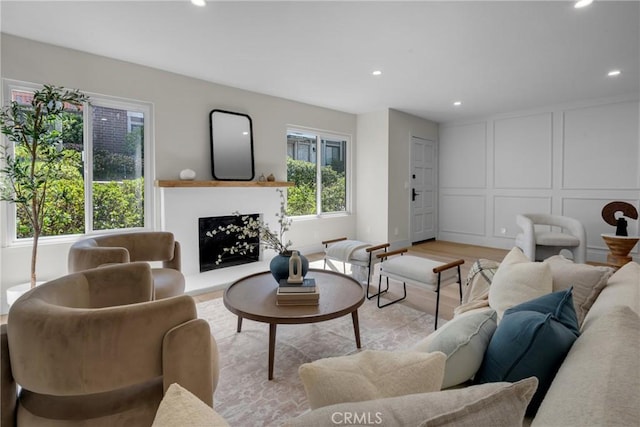 28146 Ridgecove Ct S, Rancho Palos Verdes, CA 90275 - living area with recessed lighting, a decorative wall, light wood finished floors, and a fireplace with raised hearth