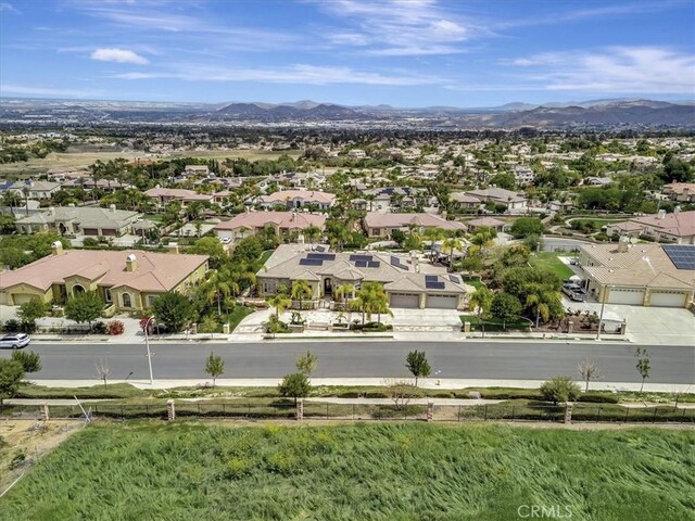 drone / aerial view featuring a mountain view and a residential view