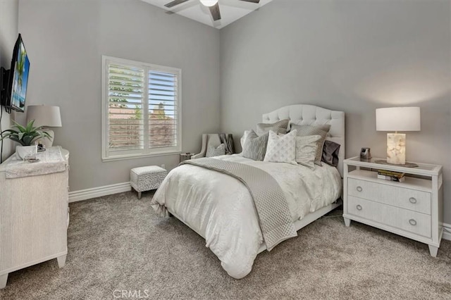 bedroom with a ceiling fan, baseboards, and carpet