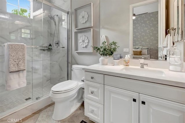 full bath featuring vanity, a stall shower, and toilet