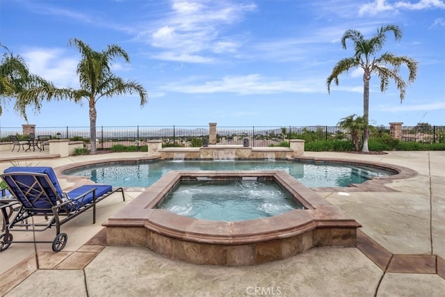 view of pool with a fenced in pool, a patio area, fence, and an in ground hot tub
