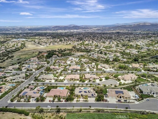 birds eye view of property featuring a mountain view and a residential view