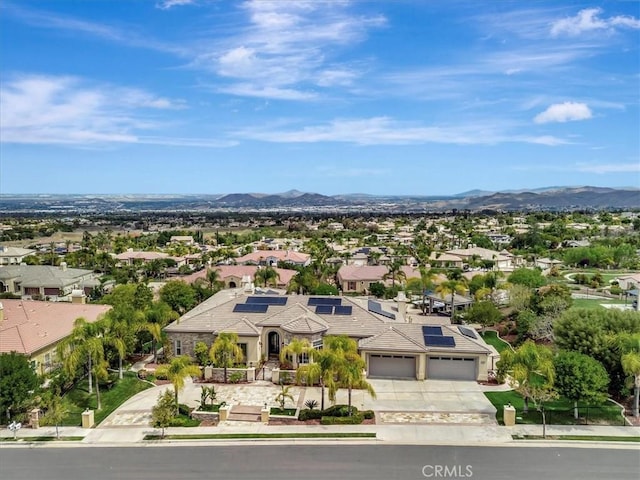 drone / aerial view with a residential view and a mountain view