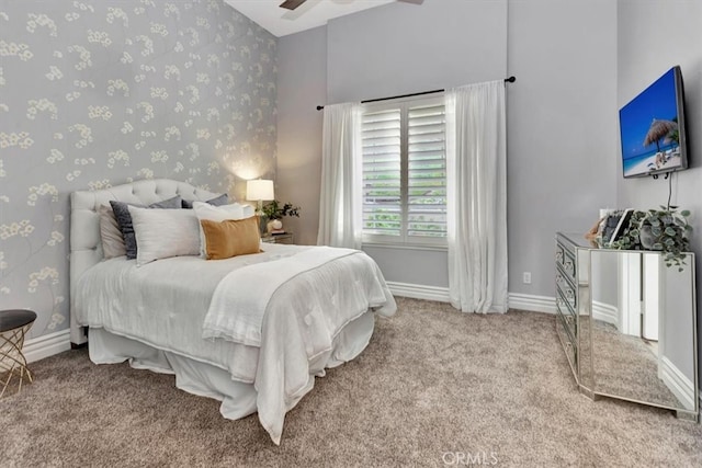 carpeted bedroom featuring baseboards, vaulted ceiling, and wallpapered walls