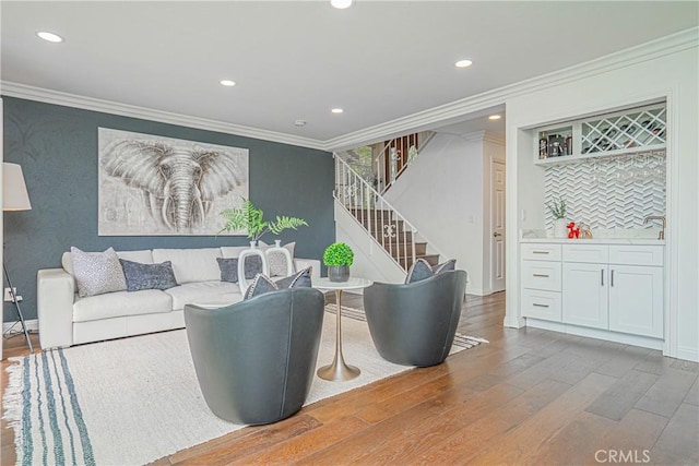 2217 Serrano Pl, Fullerton, CA 92833 - living room with crown molding, recessed lighting, wood finished floors, and stairway
