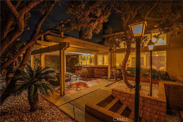 2217 Serrano Pl, Fullerton, CA 92833 - patio at night featuring a pergola