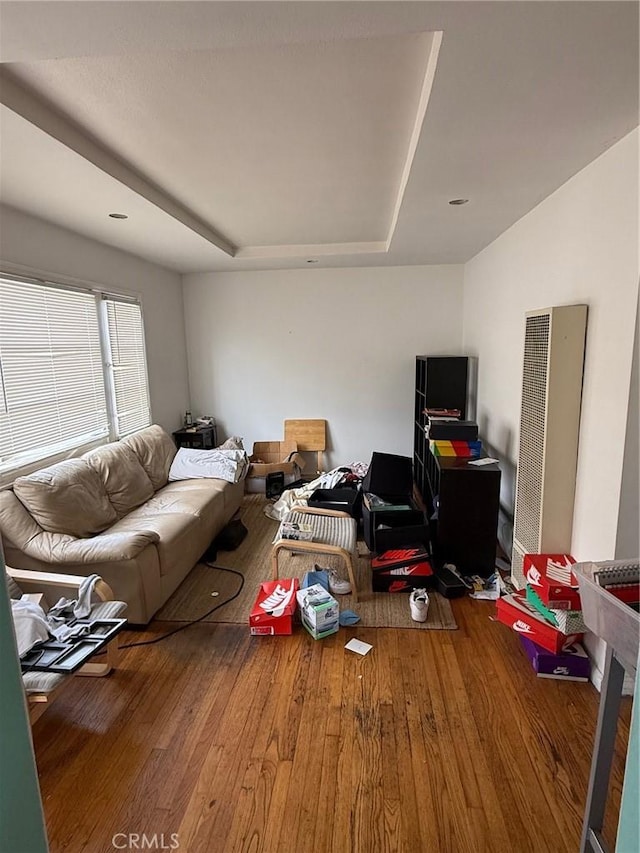 living room featuring wood finished floors and a heating unit