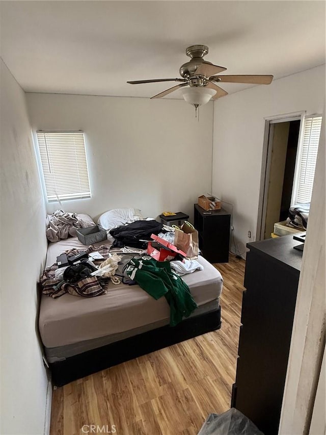 bedroom featuring a ceiling fan and light wood finished floors