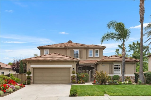 mediterranean / spanish-style house featuring stucco siding, fence, a garage, stone siding, and concrete driveway