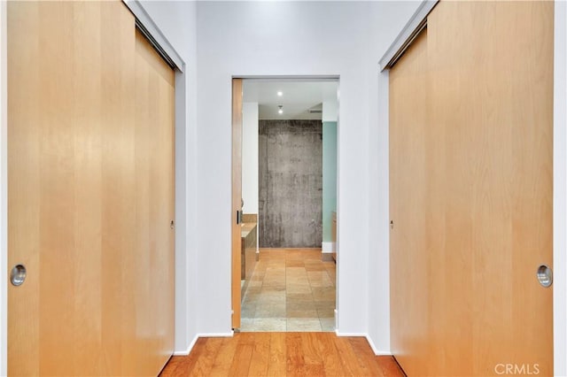 corridor featuring wood finished floors