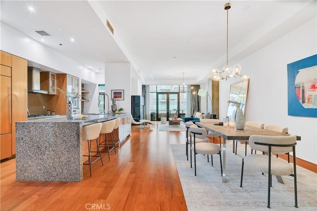 dining room with recessed lighting, visible vents, a chandelier, and light wood-type flooring