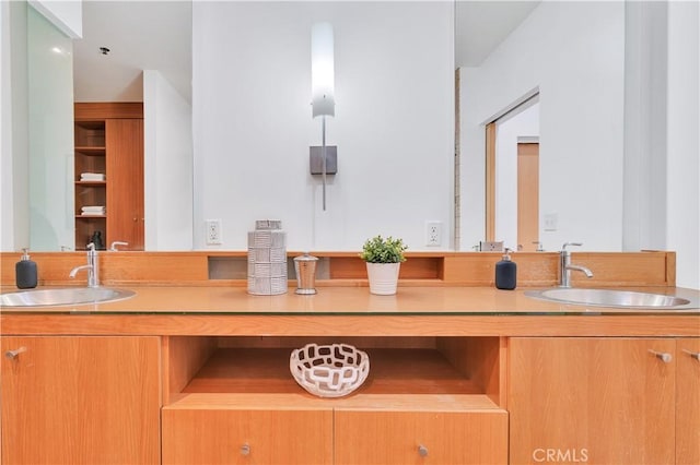 bathroom featuring double vanity and a sink