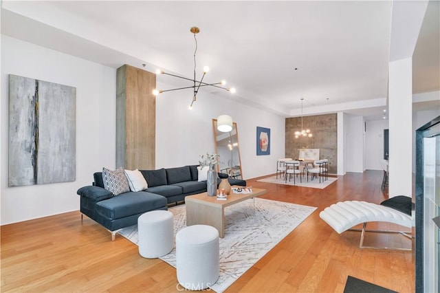 living area featuring wood finished floors and a notable chandelier