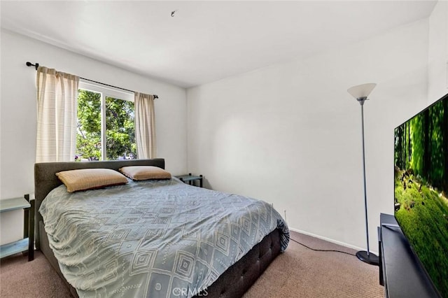 carpeted bedroom with baseboards