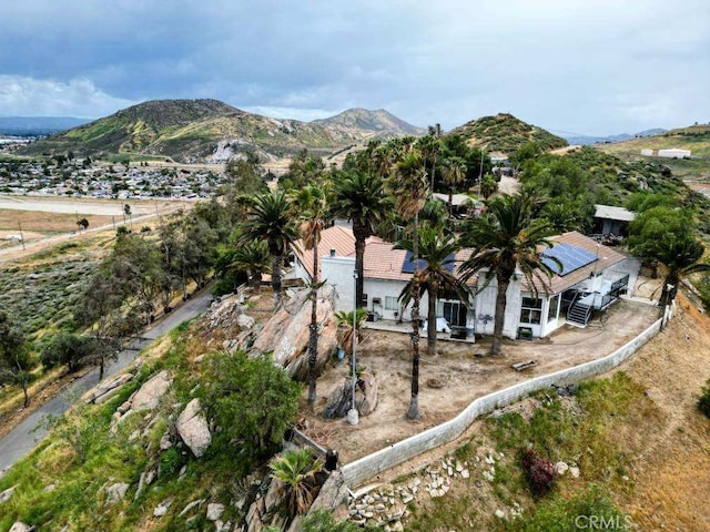 birds eye view of property featuring a mountain view