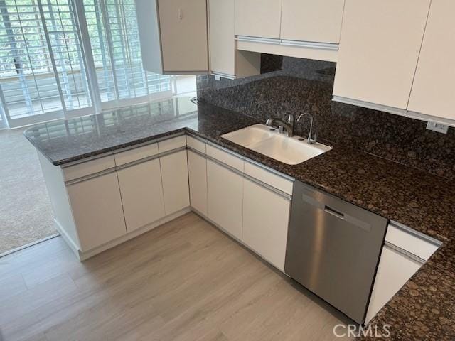 32679 Seagate Dr Unit 308-H, Rancho Palos Verdes, CA 90275 - kitchen featuring a sink, white cabinets, light wood-style flooring, and dishwasher