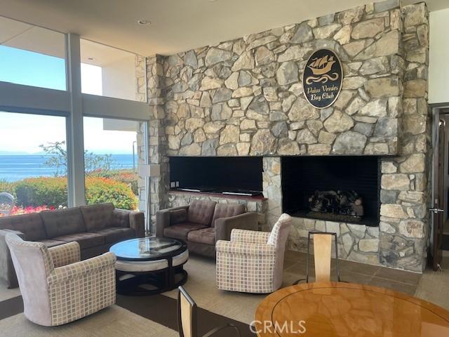 32679 Seagate Dr Unit 308-H, Rancho Palos Verdes, CA 90275 - living room with a large fireplace