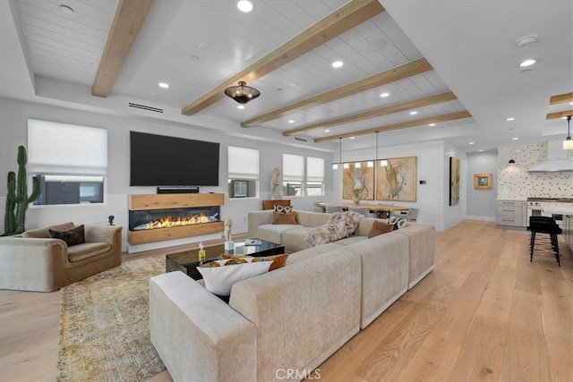 507 N Maria Ave Unit A, Redondo Beach, CA 90277 - living room featuring light wood-style floors, beam ceiling, recessed lighting, and a glass covered fireplace