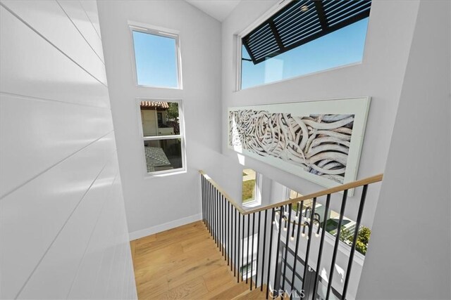 507 N Maria Ave Unit A, Redondo Beach, CA 90277 - stairway with wood finished floors, baseboards, and a towering ceiling