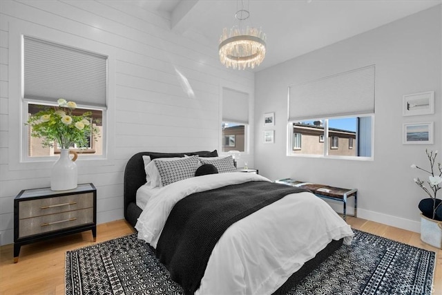 507 N Maria Ave Unit A, Redondo Beach, CA 90277 - bedroom with a chandelier, wood finished floors, and baseboards