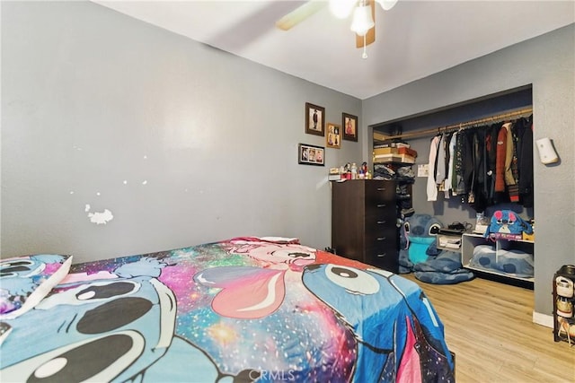 907 E 109th Pl, Los Angeles, CA 90059 - bedroom with ceiling fan, a closet, and wood finished floors