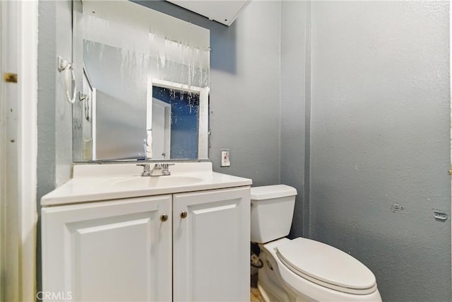 907 E 109th Pl, Los Angeles, CA 90059 - bathroom with vanity, a textured wall, and toilet