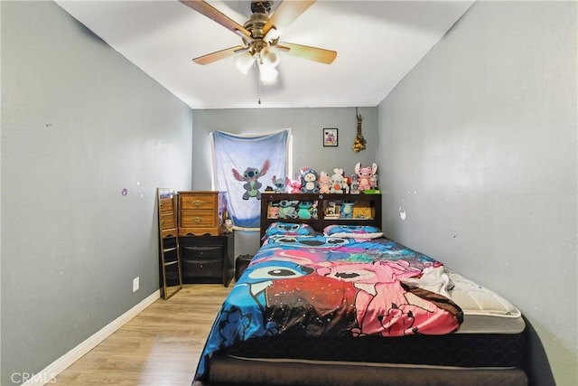 907 E 109th Pl, Los Angeles, CA 90059 - bedroom featuring baseboards, ceiling fan, and wood finished floors