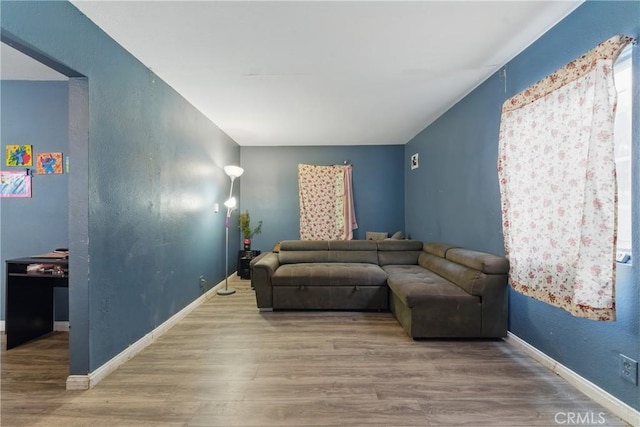 907 E 109th Pl, Los Angeles, CA 90059 - living area with baseboards and wood finished floors