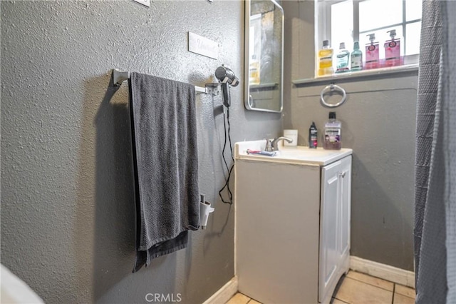 907 E 109th Pl, Los Angeles, CA 90059 - bathroom featuring tile patterned floors, baseboards, and vanity