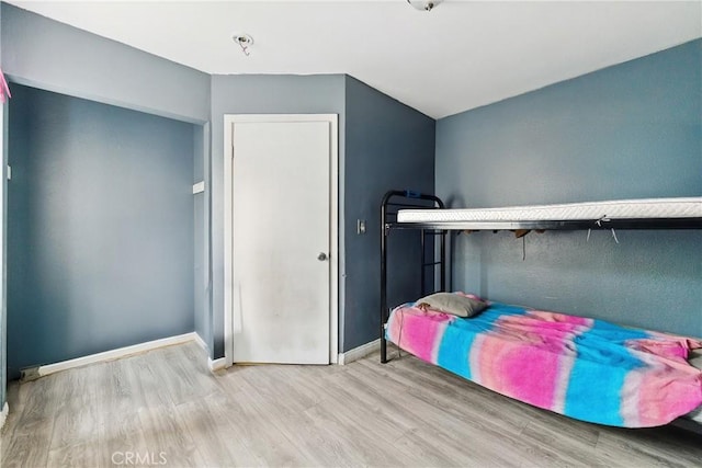907 E 109th Pl, Los Angeles, CA 90059 - bedroom featuring baseboards and wood finished floors