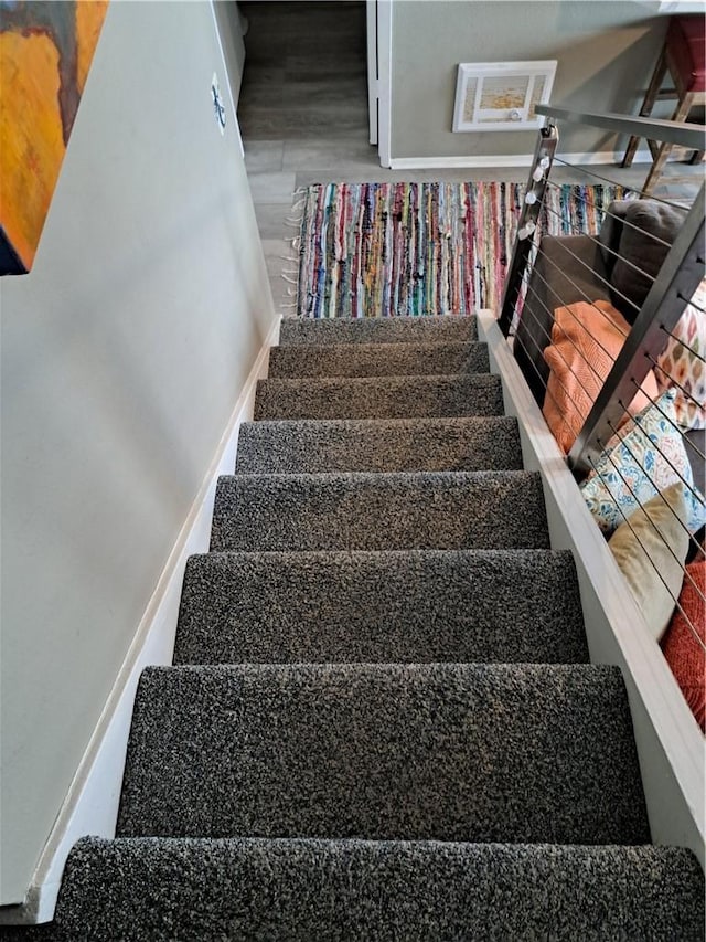 stairs with wood finished floors