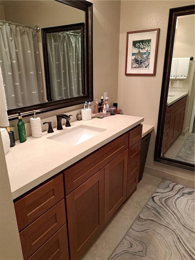 full bathroom featuring vanity and curtained shower