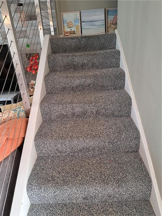 711 Pacific Coast Hwy Unit 418, Huntington Beach, CA 92648 - staircase featuring baseboards