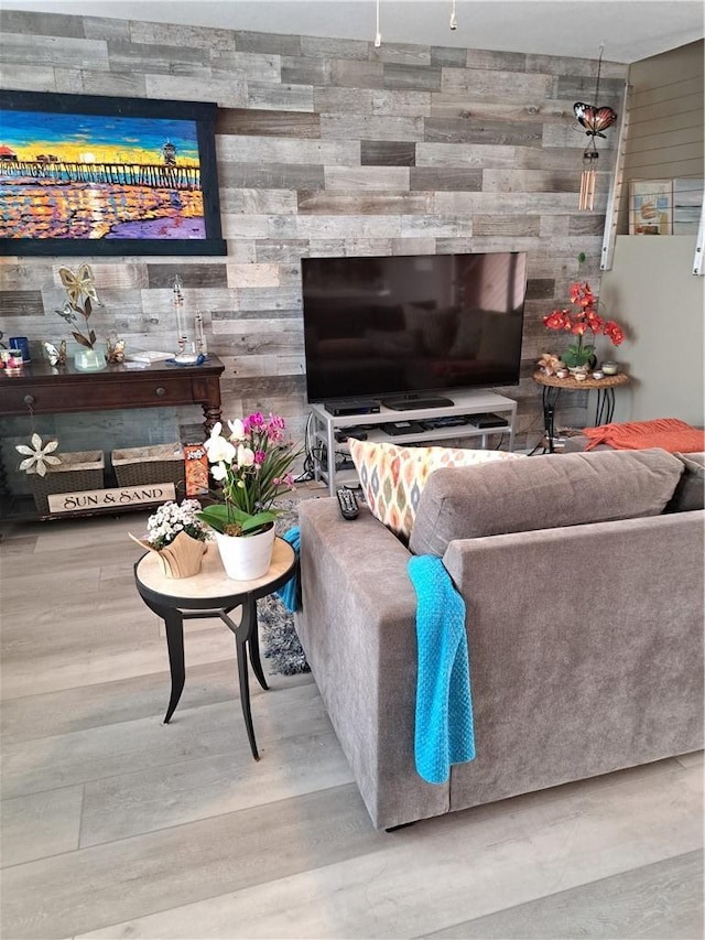 711 Pacific Coast Hwy Unit 418, Huntington Beach, CA 92648 - living area with wooden walls and wood finished floors