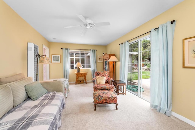 interior space featuring carpet floors, access to outside, baseboards, and a heating unit