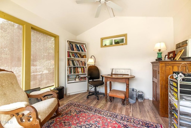 office space featuring ceiling fan, wood finished floors, and vaulted ceiling