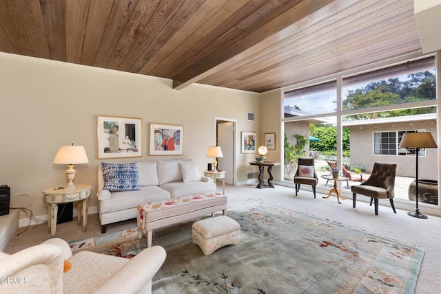 living area featuring carpet floors, baseboards, and wooden ceiling