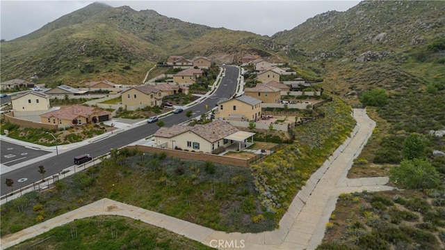 birds eye view of property with a mountain view and a residential view
