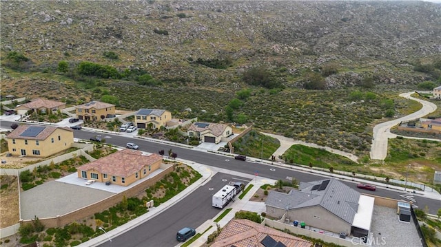 birds eye view of property with a residential view