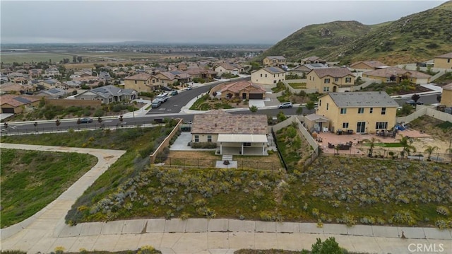 aerial view featuring a mountain view and a residential view