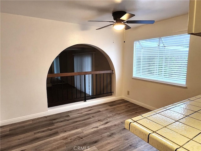 4872 Emerald Ave, La Verne, CA 91750 - unfurnished bedroom with baseboards, wood finished floors, and a ceiling fan