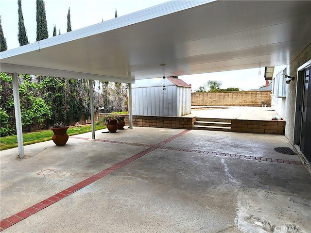 4872 Emerald Ave, La Verne, CA 91750 - view of patio with fence, a storage shed, and an outbuilding