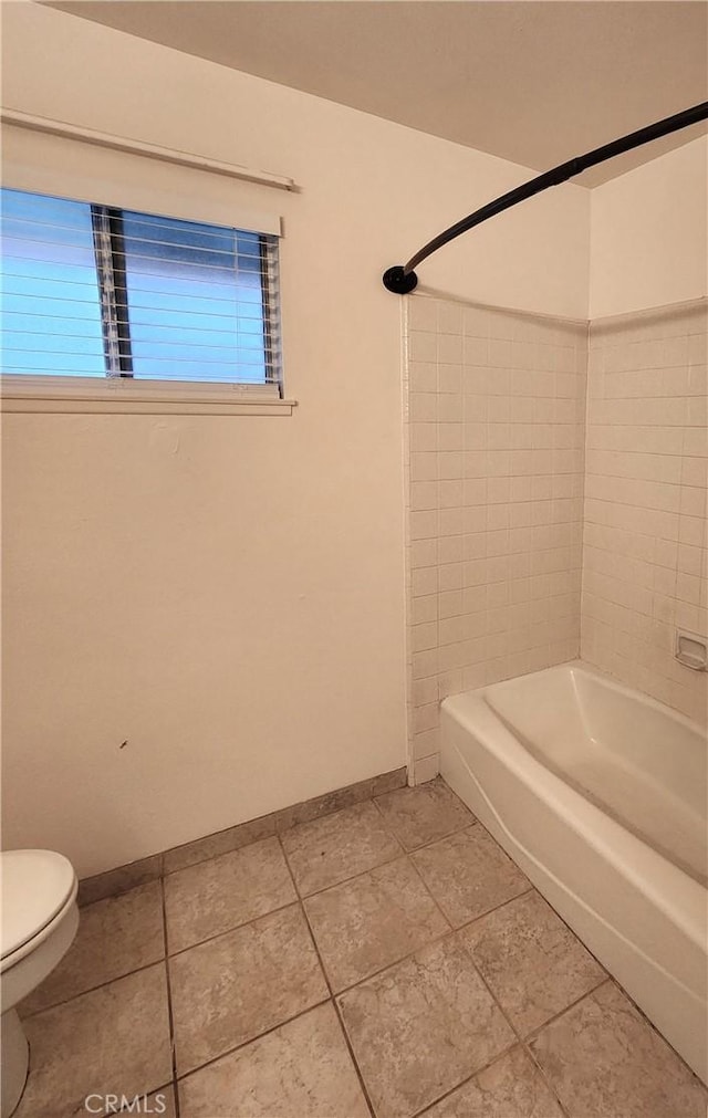 4872 Emerald Ave, La Verne, CA 91750 - bathroom featuring toilet, shower / washtub combination, and baseboards