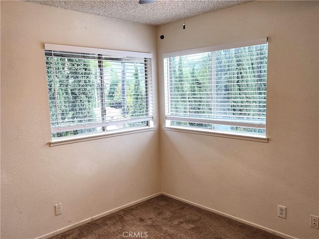 4872 Emerald Ave, La Verne, CA 91750 - spare room featuring a textured ceiling, a textured wall, carpet flooring, and baseboards