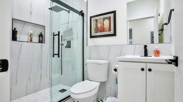 10301 Antigua St, Anaheim, CA 92804 - full bathroom with vanity, toilet, a marble finish shower, and tile walls