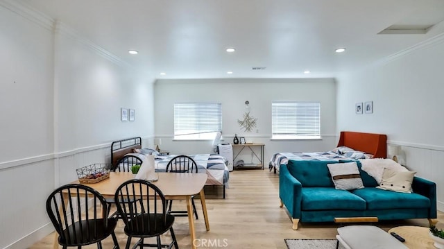 10301 Antigua St, Anaheim, CA 92804 - interior space featuring crown molding, light wood finished floors, a wainscoted wall, and visible vents