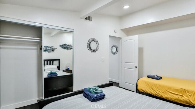 10301 Antigua St, Anaheim, CA 92804 - bedroom featuring recessed lighting, beam ceiling, a closet, visible vents, and wood finished floors