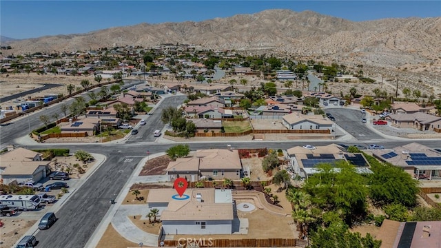 drone / aerial view with a mountain view and a residential view
